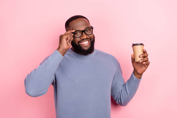 Photo of funny afro guy wear grey pullover arm glasses holding coffee cup isolated pink color background - Photo, image