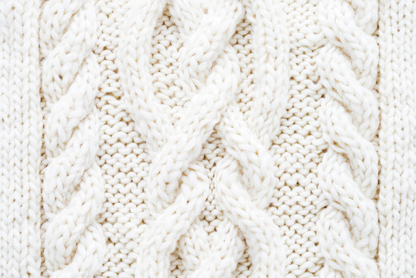 Fondo de textura de patrón de lana de punto blanco. Prendas hechas a mano. Vista superior - Foto, imagen
