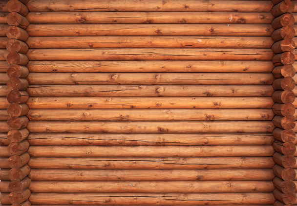A wall of the pine round timbers. Wooden texture. - Zdjęcie, obraz