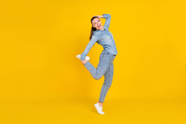 Full length body size photo young pretty girl relaxing at party laughing isolated bright yellow color background - Valokuva, kuva