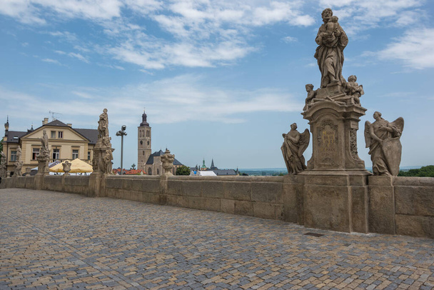 Kutna Hora, Czech Republic, June 2019 - view of the famous pseudo bridge in front of the Jesuit College with it's 13 saint statues that resembles  Prague's Charles Bridge       - Фото, изображение