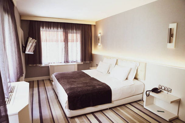 Comfort hotel bedroom in luxury style - Фото, изображение