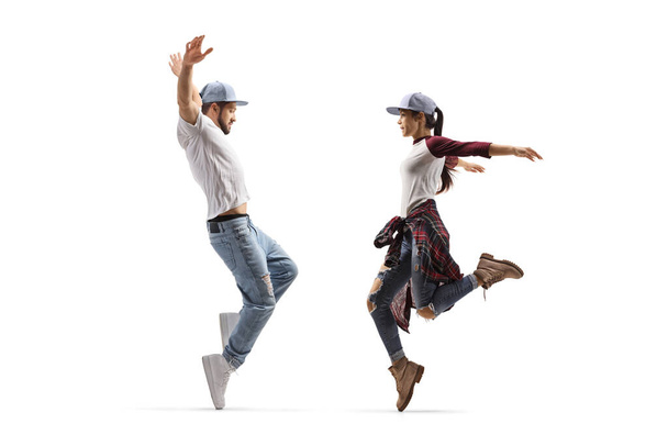 Full length shot of young dancers in casual clothes dancing isolated on white background - Photo, image