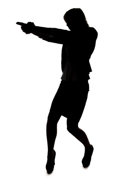 silhouet van vrouw met pistool - Foto, afbeelding