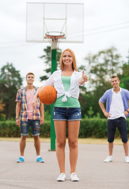 group of smiling teenagers playing basketball - Valokuva, kuva
