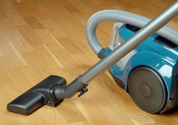 Vacuum cleaner on a oak parquet - Photo, Image