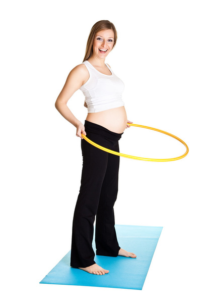 Pregnant woman fitness isolated on white - Valokuva, kuva