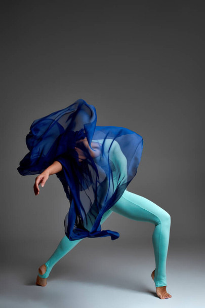 Ballerina Dancing with Silk Fabric, Modern Ballet Dancer in Fluttering Waving Cloth, Gray Background - Foto, Imagem
