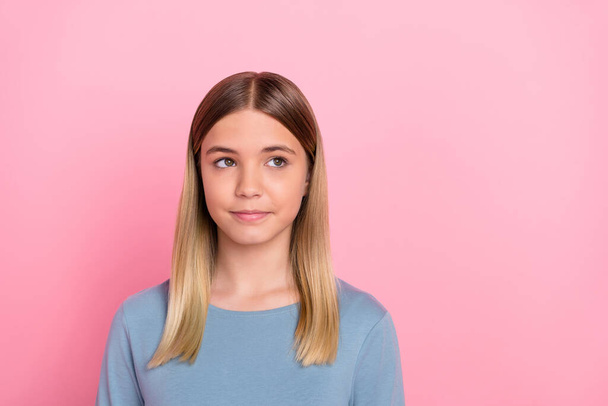 Photo of young lovely lady wondered look empty space minded think isolated over pink color background - Photo, Image