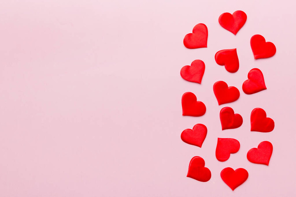 Valentine day background with red hearts, top view with copy space. - Photo, Image