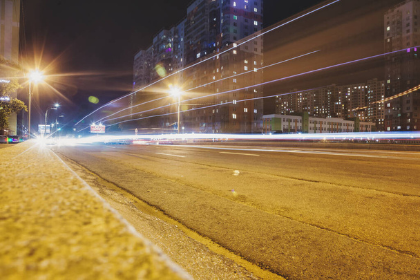 Abstract motion blur background of night street with car and street lamps. City life, lights from cityscape, style color tone. Concept of abstract stylish urban backgrounds for design. Copy space - Foto, Imagem