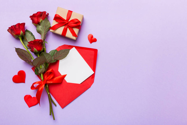 Valentine day composition with Envelope, rose flower and Red heart on table. Top view, flat lay. Holiday concept. - Fotografie, Obrázek