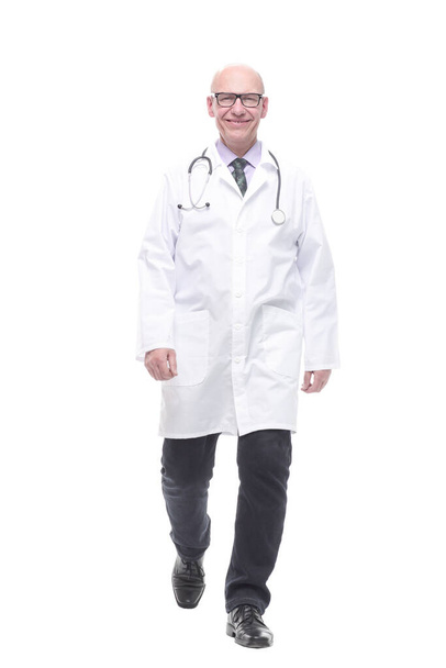 male doctor with a stethoscope striding forward. - Photo, Image