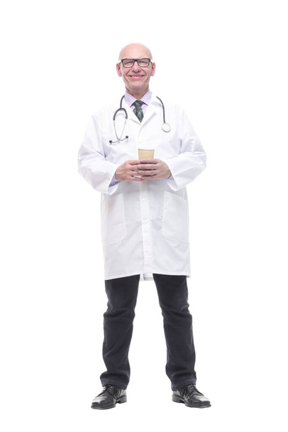smiling doctor with a takeaway coffee. isolated on a white - Foto, Imagen