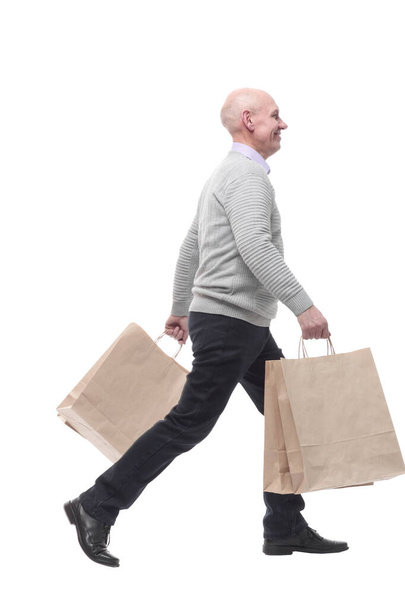 in full growth. happy man with shopping bags. - Valokuva, kuva