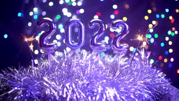 Celebrating New Year 2022 Camera Pans Around Christmas Decorations and Sparklers - Footage, Video