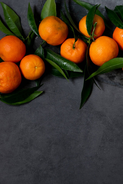 Fresh raw tangerine on dark background, healthy food ingredients - Φωτογραφία, εικόνα