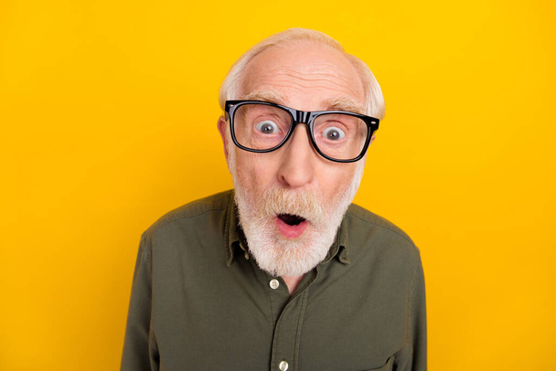Photo of astonished aged person open mouth look speechless camera isolated on yellow color background - Fotografie, Obrázek