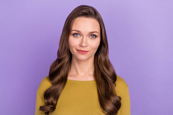 Photo of calm peaceful girl tender smile look camera nice wavy hairdo isolated on violet color background - Zdjęcie, obraz