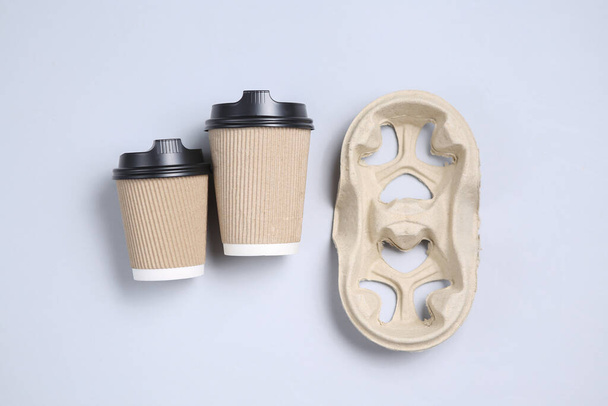 Mock up cardboard cups on a gray background. Top view - Photo, Image