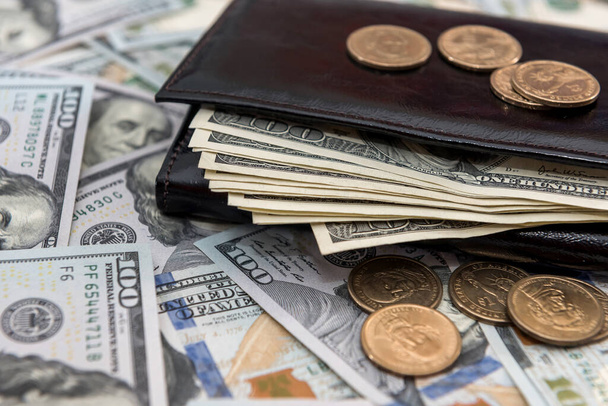 American dollars and cents in dark leather wallet. Business financial concept. - Photo, Image
