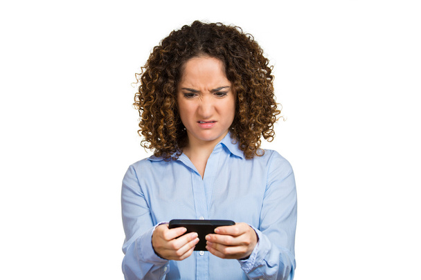 Woman unhappy, annoyed by someone on her cell phone while texting - Foto, Imagem