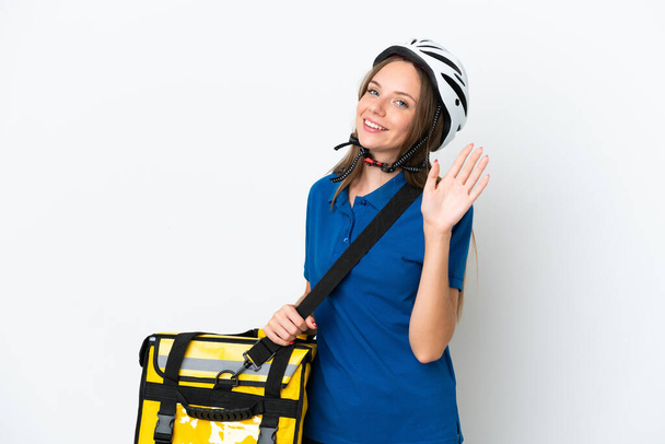 Lithuanian woman with thermal backpack saluting with hand with happy expression - Photo, Image