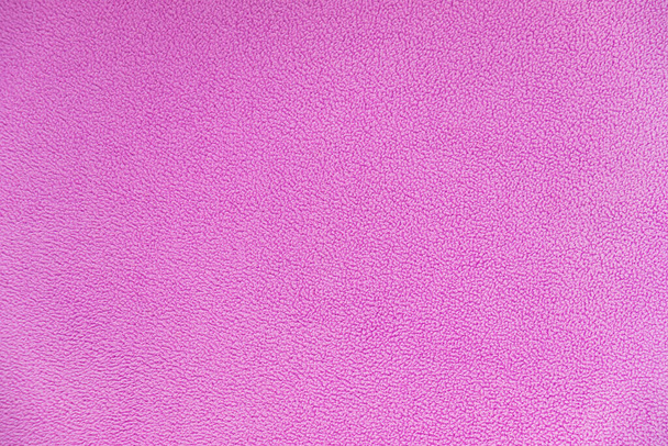 ピンクのフリース生地の背景色。選択的焦点。柔軟な背景 - 写真・画像