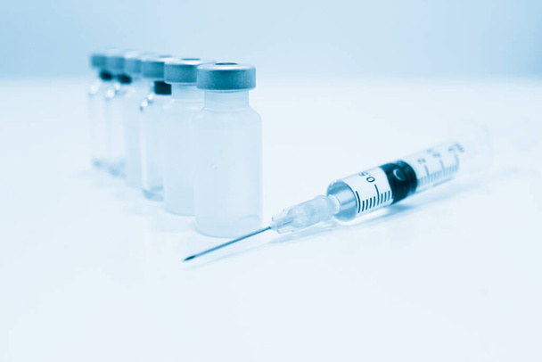 Vial of Drug, Vaccine and 3 ml Plastic Syringe with Needle Isolated on the White Background - Foto, imagen