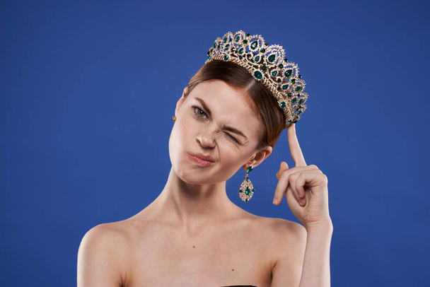 portrait of a woman with a crown on her head makeup model hand gesture isolated background - Фото, зображення