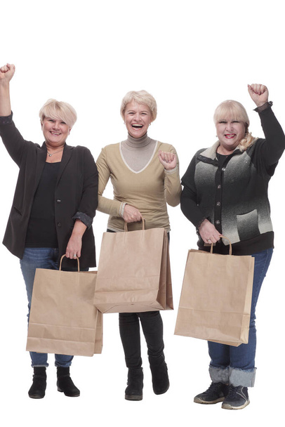 in full growth. three happy women with shopping bags. - Fotografie, Obrázek