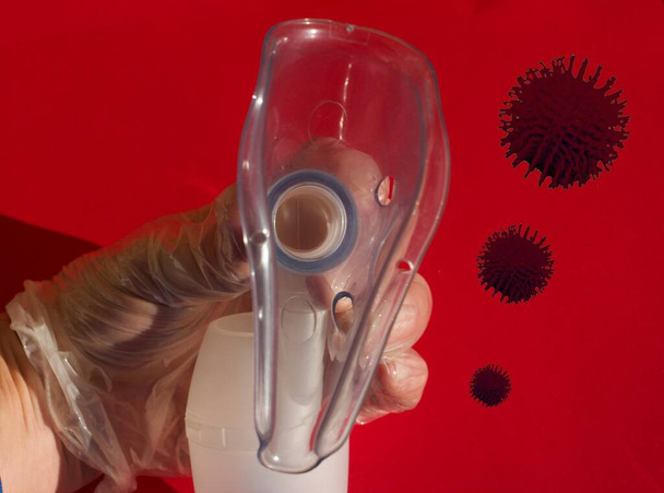 Close up of a doctor hand holding a Cpap mask virus cells - Fotografie, Obrázek