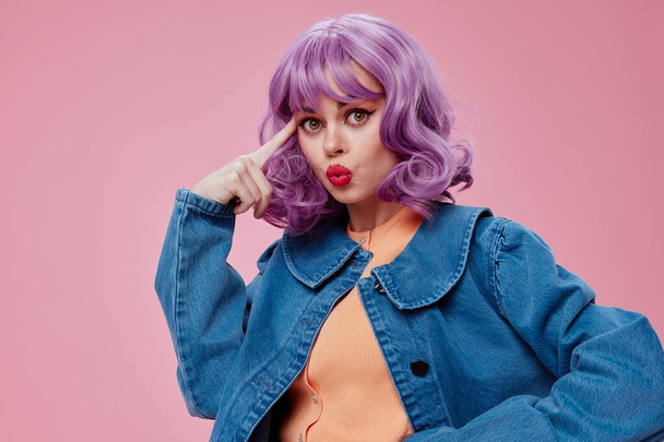 Beautiful fashionable girl wavy purple hair blue jacket emotions fun studio model unaltered - Photo, Image