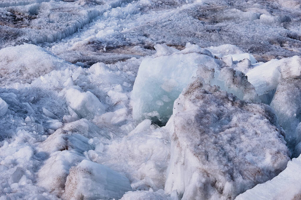 Melting river ice. Columnar and needle-like structure of crystals. Ice floe in the spring on the banks of the Amur River. Close view. Large blocks of solid water. Selective focus. - 写真・画像