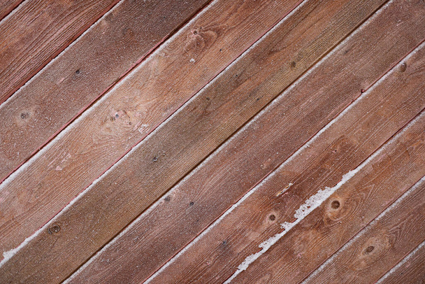background of brown boards at an angle of 45 degrees covered with frost. copy space. - Foto, Imagen