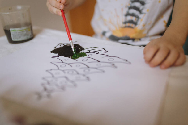 kids hand drawing christmas tree on paper with gouache. High quality photo - Fotoğraf, Görsel