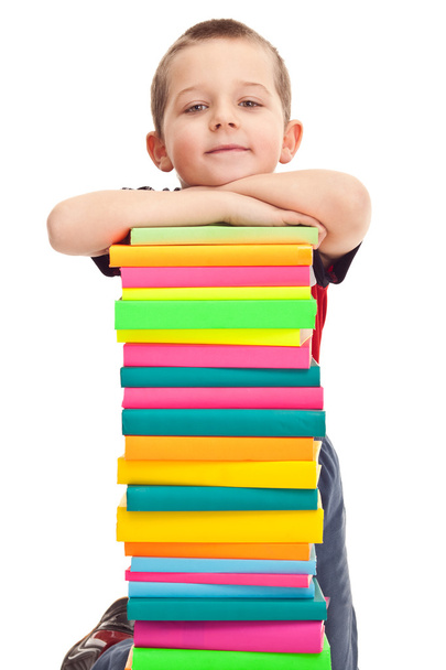 Little boy with pile of books - 写真・画像