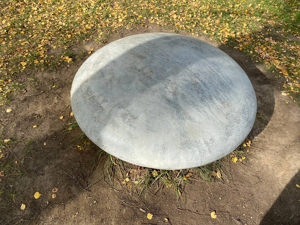 round stone in park at dry sunny autumn day - Фото, зображення