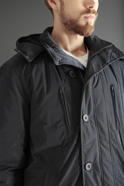 Black down jacket. Men's clothing. - Foto, Imagen