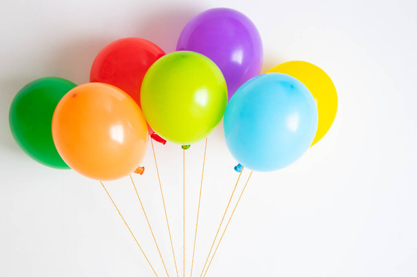 Multicolored balloons. Many colorful festive, joyful balloons.  - Фото, изображение
