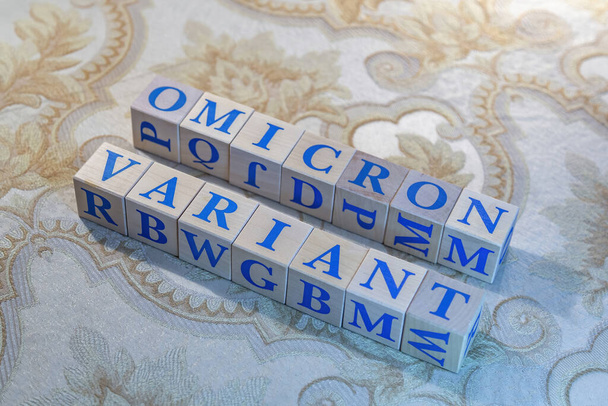 Wooden cubes with word Omicron in blue letters - Foto, Bild