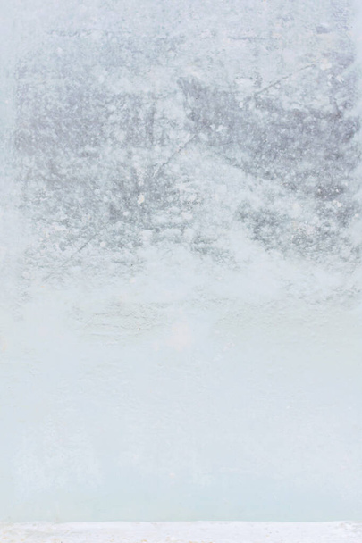 Текстурированная серая полупрозрачная поверхность ледяной плиты. - Фото, изображение