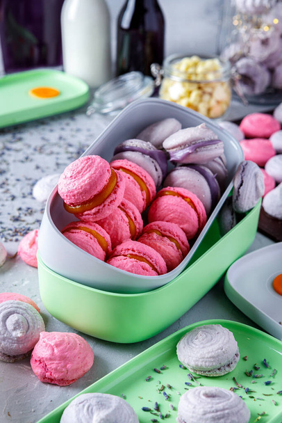 Pink and purple macaroons/meringues in containers step-by-step recipe - Photo, image