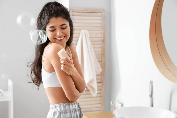 Morning of beautiful young woman with soap in bathroom - Photo, Image