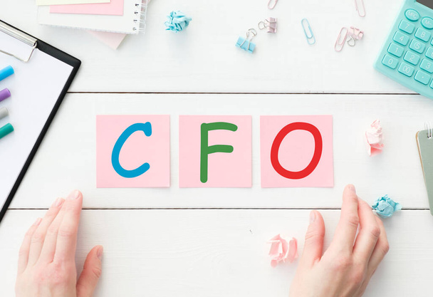 CFO, Chief Financial Officer, TEXT ON white paper on light background - Foto, Imagen