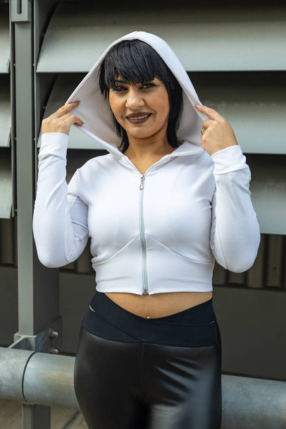 Young cute black hair woman posing with stylish Hoodie  - 写真・画像