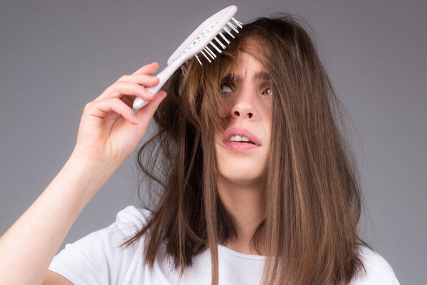Hair loss woman with a comb and problem hair. Hairloss and bald problems concept. - Foto, Imagem