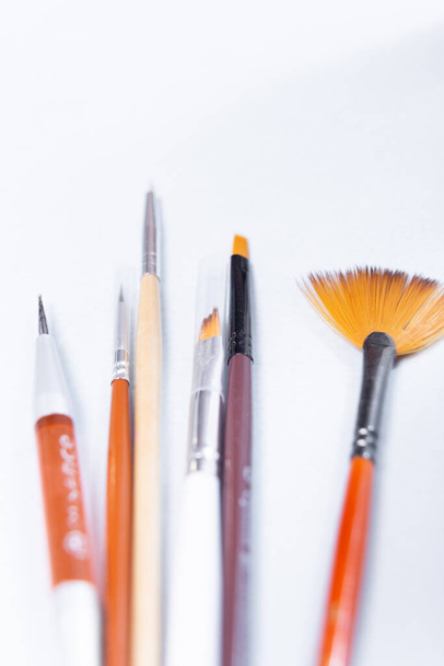 set nail art brushes on a light background, top view - Zdjęcie, obraz