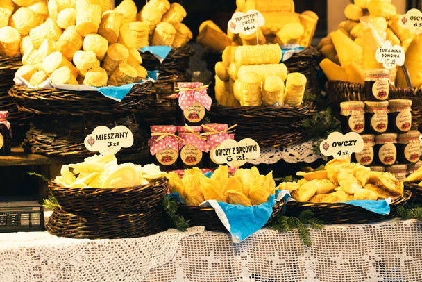 Traditional polish smoked cheese "oscypek" at a Christmas Market stall in Krakow, Poland. - Photo, Image