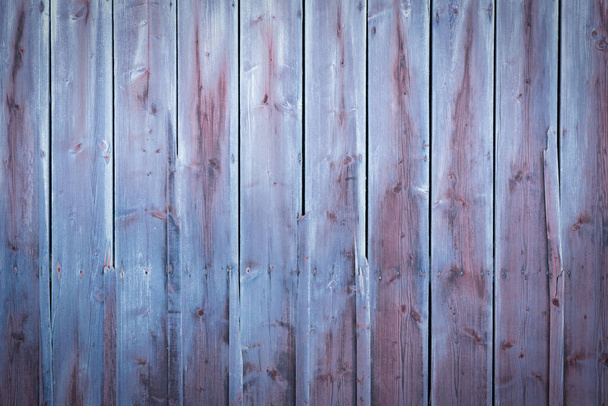 Blue and purple wood background with weathered planks with fading colors - Фото, изображение
